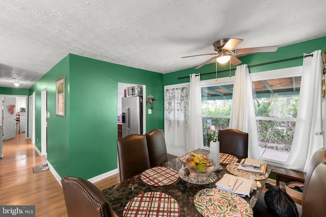 320 Lee St, Front Royal, VA 22630 - dining area featuring a textured ceiling, ceiling fan, light wood-style flooring, and baseboards