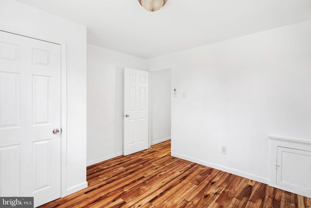 3545 Emerald St, Philadelphia, PA 19134 - unfurnished bedroom with wood finished floors and baseboards