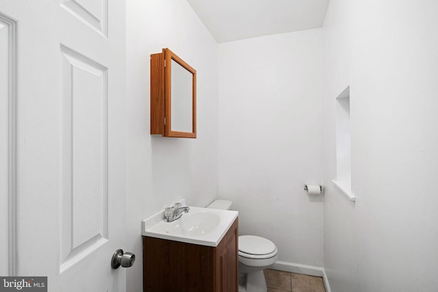 3545 Emerald St, Philadelphia, PA 19134 - bathroom with vanity, toilet, tile patterned flooring, and baseboards