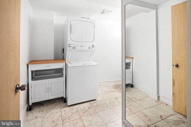 810 N Hancock St Unit 2, Philadelphia, PA 19123 - laundry area featuring estacked washer and dryer and light marble finish flooring