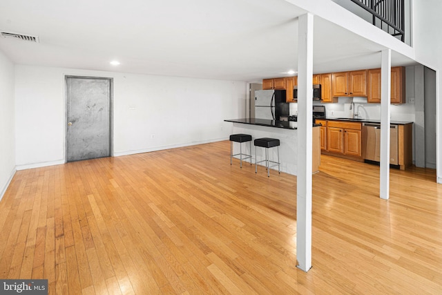 810 N Hancock St Unit 2, Philadelphia, PA 19123 - unfurnished living room featuring light wood-style flooring and recessed lighting