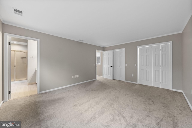 8 Railroad Pl, Pennington, NJ 08534 - unfurnished bedroom with carpet flooring, two closets, connected bathroom, and ornamental molding