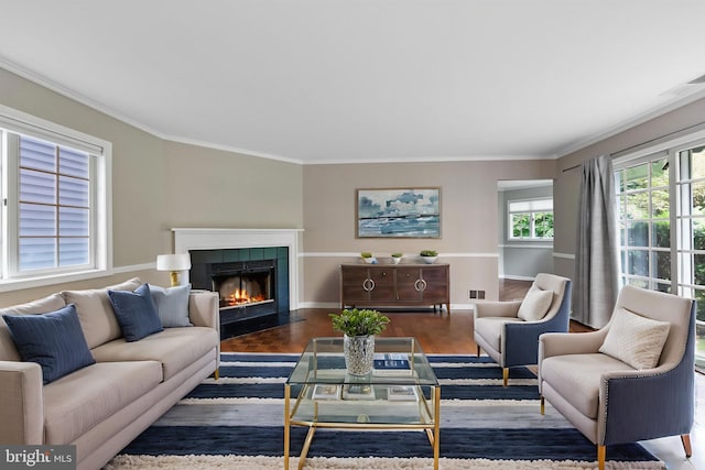 8 Railroad Pl, Pennington, NJ 08534 - living room featuring crown molding, a tiled fireplace, and wood finished floors