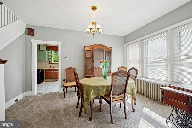 1865 Marshall, Norristown, PA 19403 - dining space featuring radiator, a chandelier, light carpet, and baseboards