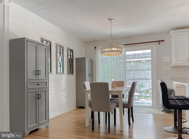 26055 Prospect Hill Rd, Mechanicsville, MD 20659 - dining room with a textured ceiling, a chandelier, and light wood-style floors