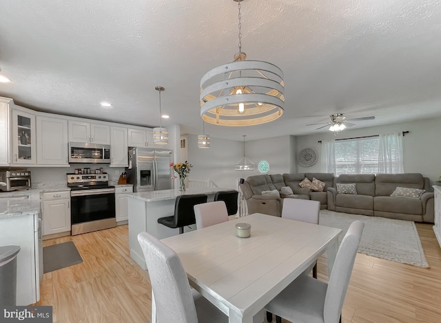 26055 Prospect Hill Rd, Mechanicsville, MD 20659 - dining room featuring light wood-style flooring, a ceiling fan, and recessed lighting