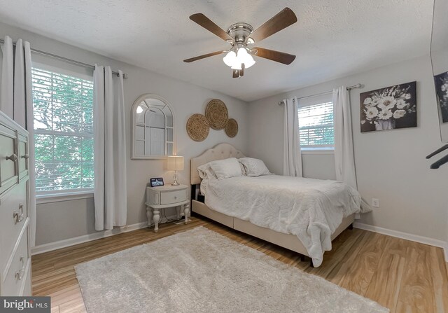 26055 Prospect Hill Rd, Mechanicsville, MD 20659 - bedroom featuring light wood-type flooring, baseboards, and ceiling fan