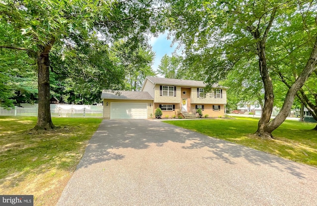 26055 Prospect Hill Rd, Mechanicsville, MD 20659 - raised ranch featuring an attached garage, asphalt driveway, and brick siding