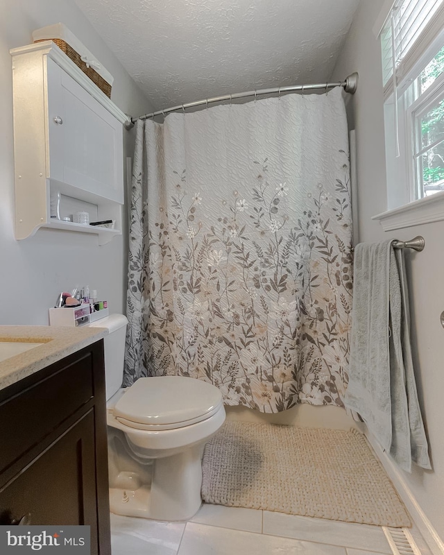 26055 Prospect Hill Rd, Mechanicsville, MD 20659 - bathroom featuring toilet, vanity, a shower with shower curtain, tile patterned floors, and a textured ceiling