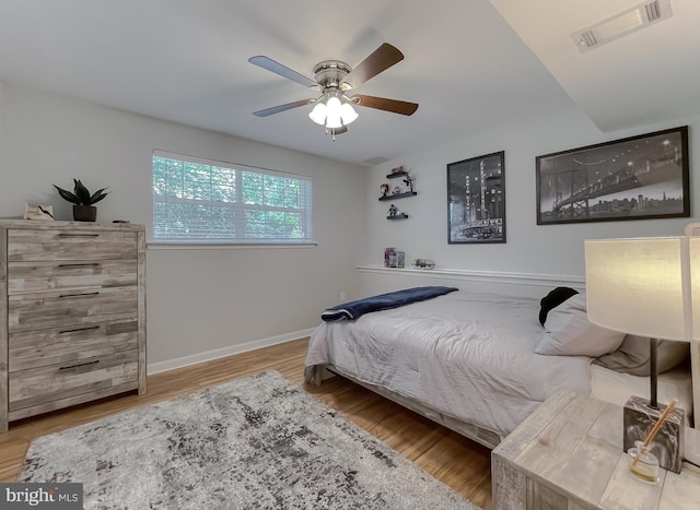 26055 Prospect Hill Rd, Mechanicsville, MD 20659 - bedroom featuring wood finished floors, baseboards, and a ceiling fan