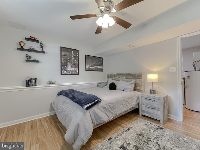 26055 Prospect Hill Rd, Mechanicsville, MD 20659 - bedroom with water heater, wood finished floors, baseboards, and ceiling fan