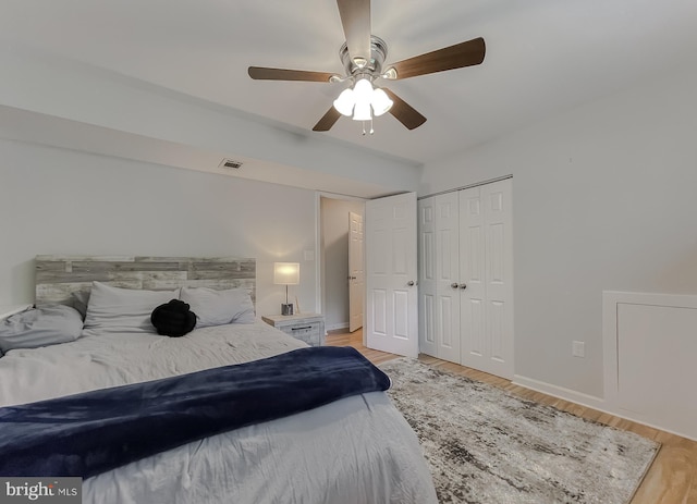 26055 Prospect Hill Rd, Mechanicsville, MD 20659 - bedroom featuring light wood-type flooring, a closet, baseboards, and a ceiling fan