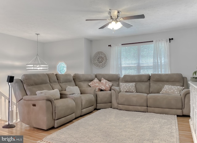 26055 Prospect Hill Rd, Mechanicsville, MD 20659 - living room with plenty of natural light, light wood-style flooring, a chandelier, and ceiling fan