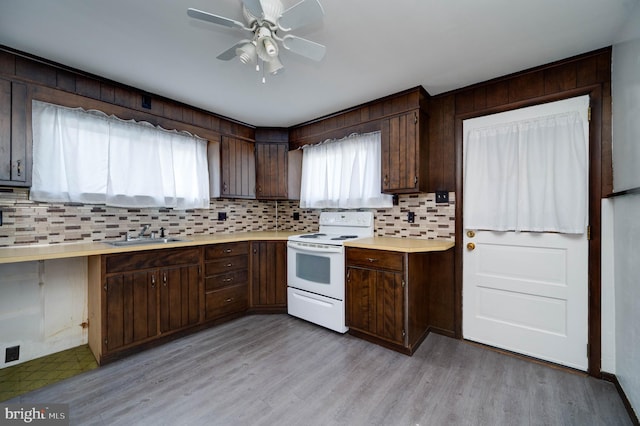 328 W Summit St, Mohnton, PA 19540 - kitchen featuring white electric range oven, a sink, light countertops, and decorative backsplash