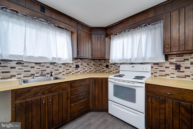 328 W Summit St, Mohnton, PA 19540 - kitchen featuring white electric stove, a sink, tasteful backsplash, and light countertops