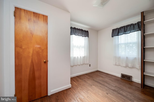 328 W Summit St, Mohnton, PA 19540 - unfurnished bedroom featuring multiple windows, hardwood / wood-style flooring, and baseboards