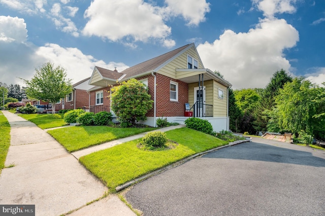 328 W Summit St, Mohnton, PA 19540 - bungalow featuring brick siding and a front yard