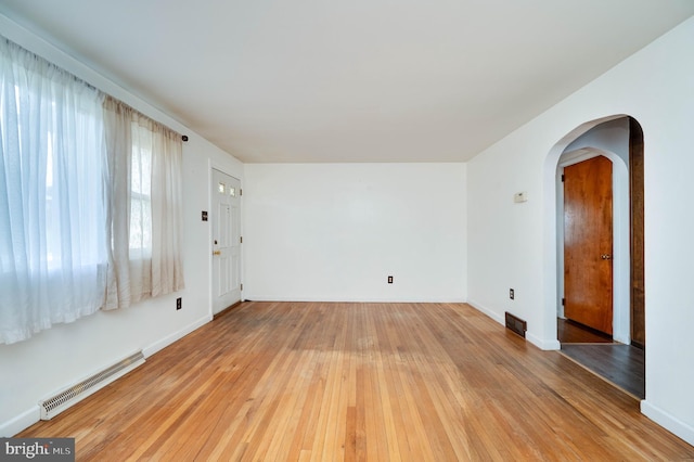 328 W Summit St, Mohnton, PA 19540 - spare room featuring arched walkways, light wood finished floors, and baseboards