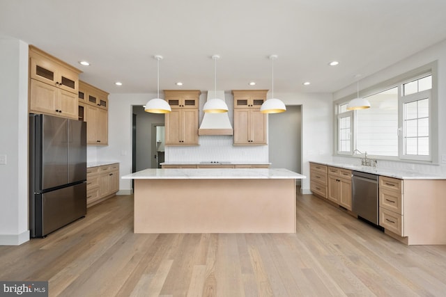 135 Radnor Ct, Rockingham, VA 22801 - kitchen featuring stainless steel appliances, premium range hood, a center island, backsplash, and light wood-style flooring