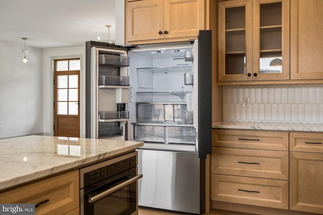 135 Radnor Ct, Rockingham, VA 22801 - kitchen with wall oven, backsplash, light stone counters, glass insert cabinets, and stainless steel fridge