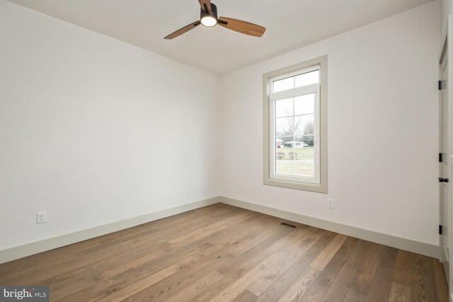 135 Radnor Ct, Rockingham, VA 22801 - empty room featuring baseboards, wood finished floors, and a ceiling fan