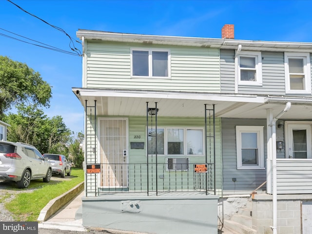 220 Fisher Ave, Coaldale, PA 18218 - townhome / multi-family property with a porch and a chimney