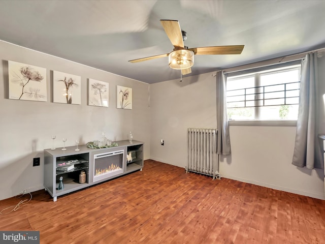220 Fisher Ave, Coaldale, PA 18218 - unfurnished room featuring radiator, wood finished floors, ceiling fan, and baseboards