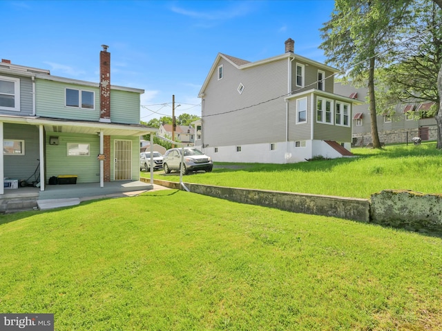 220 Fisher Ave, Coaldale, PA 18218 - rear view of property with a chimney and a yard