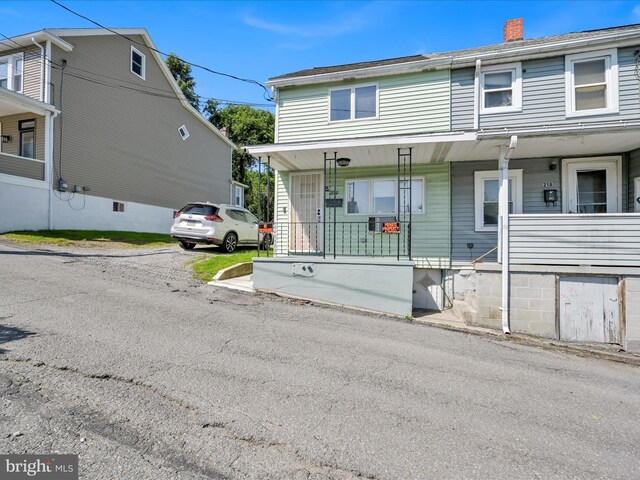 220 Fisher Ave, Coaldale, PA 18218 - view of property with covered porch and a chimney