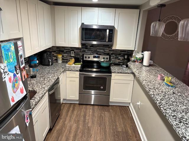 632 Bath Rd, Bristol, PA 19007 - kitchen with stainless steel appliances, dark wood finished floors, decorative backsplash, and white cabinets