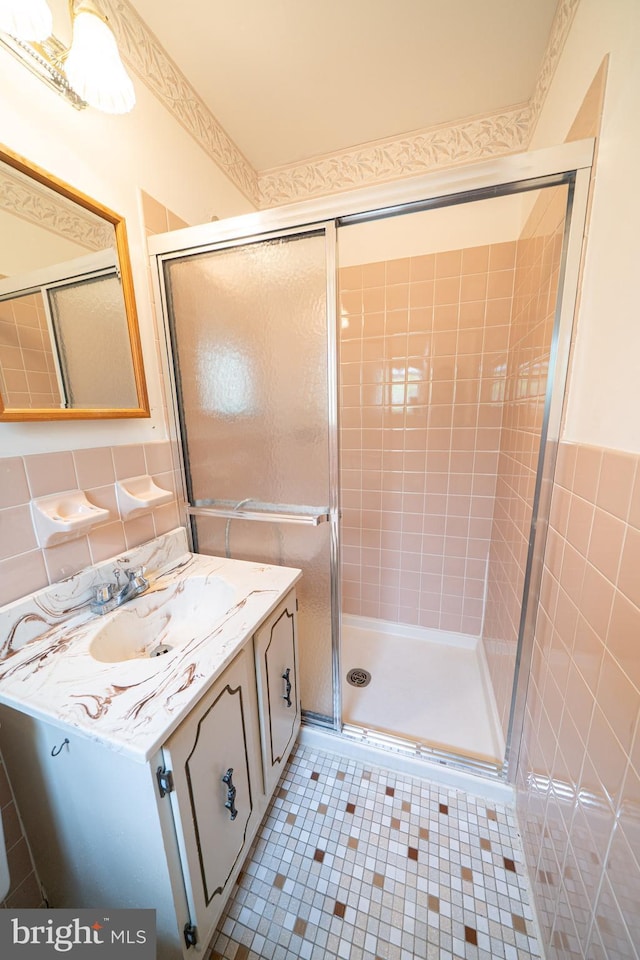 7911 Farnsworth St, Philadelphia, PA 19152 - bathroom with vanity, tile walls, a shower stall, and tile patterned flooring