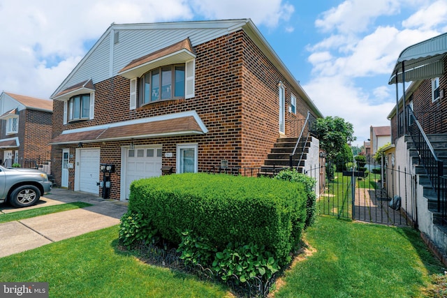 7911 Farnsworth St, Philadelphia, PA 19152 - view of front of property with brick siding, concrete driveway, an attached garage, and stairs