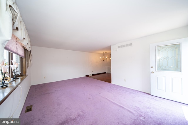 7911 Farnsworth St, Philadelphia, PA 19152 - unfurnished living room with a chandelier and carpet floors