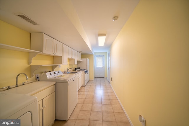 7911 Farnsworth St, Philadelphia, PA 19152 - washroom featuring a sink, light tile patterned flooring, washing machine and clothes dryer, and baseboards