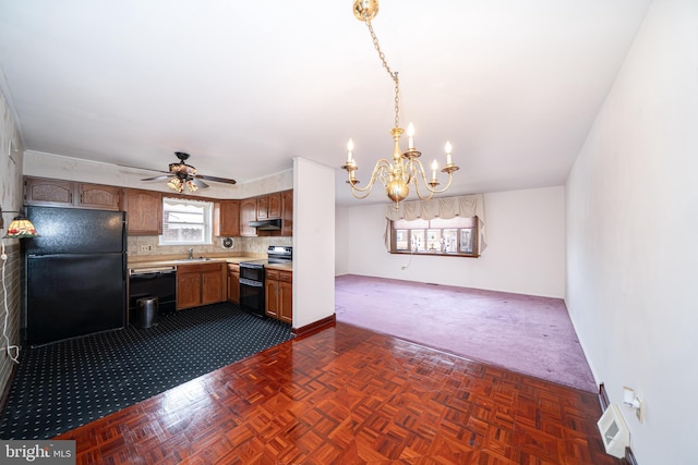 7911 Farnsworth St, Philadelphia, PA 19152 - kitchen with black appliances, a sink, dark colored carpet, light countertops, and a chandelier