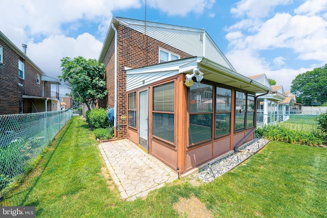 7911 Farnsworth St, Philadelphia, PA 19152 - view of side of property with a sunroom and brick siding