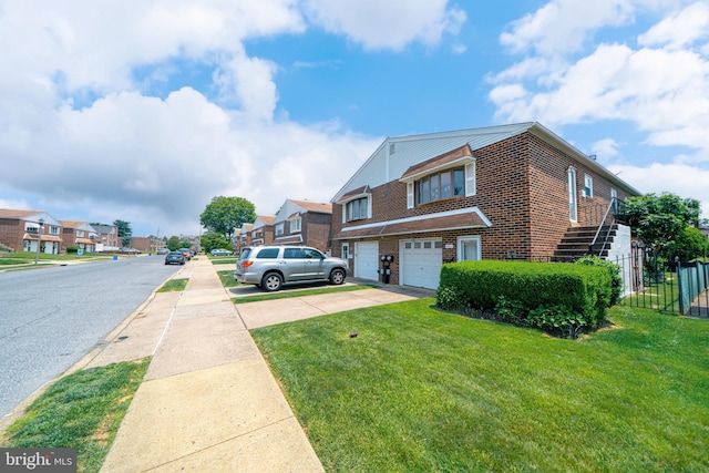 7911 Farnsworth St, Philadelphia, PA 19152 - view of front of house featuring brick siding, driveway, a garage, and a residential view