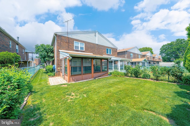 7911 Farnsworth St, Philadelphia, PA 19152 - rear view of property with a sunroom and brick siding
