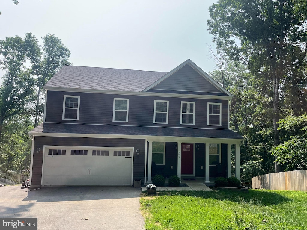 261 Cone Ct, Martinsburg, WV 25405 - view of front of house with driveway, an attached garage, covered porch, and roof with shingles