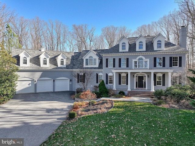 1637 Cold Bottom Rd, Sparks Glencoe, MD 21152 - colonial home with driveway, a chimney, a porch, and a front lawn