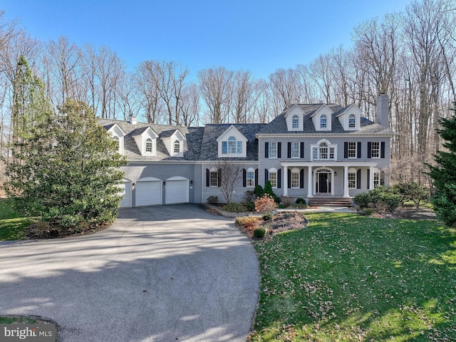 1637 Cold Bottom Rd, Sparks Glencoe, MD 21152 - view of front of house featuring driveway, a chimney, a garage, a porch, and a front yard
