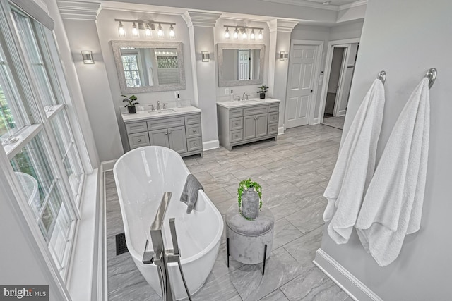 1637 Cold Bottom Rd, Sparks Glencoe, MD 21152 - bathroom with ornamental molding, marble look tiles, two vanities, and a soaking tub