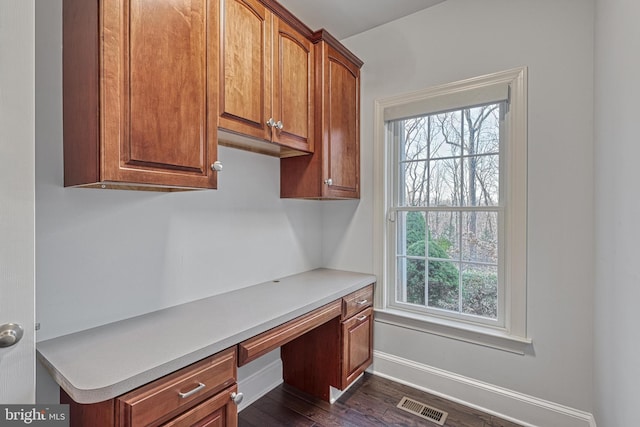 1637 Cold Bottom Rd, Sparks Glencoe, MD 21152 - unfurnished office with built in desk, dark wood-style floors, and baseboards