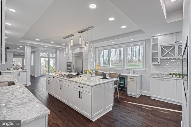 1637 Cold Bottom Rd, Sparks Glencoe, MD 21152 - kitchen with a raised ceiling, a center island, wine cooler, stainless steel appliances, and dark wood-style flooring