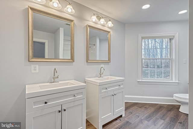 1637 Cold Bottom Rd, Sparks Glencoe, MD 21152 - full bathroom with two vanities, wood finished floors, toilet, baseboards, and recessed lighting