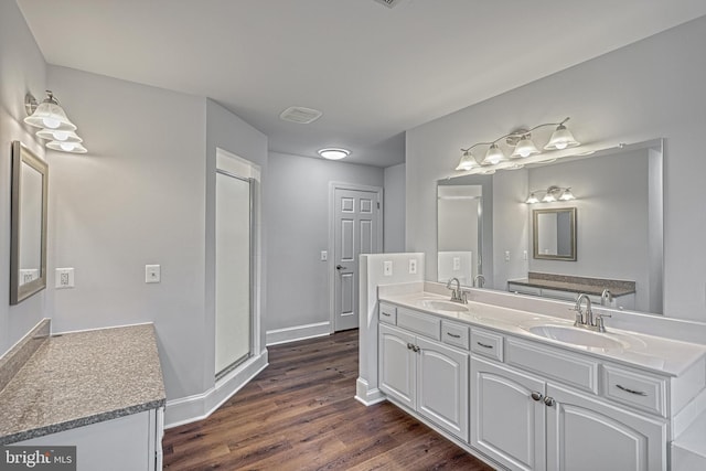 1637 Cold Bottom Rd, Sparks Glencoe, MD 21152 - full bath with wood finished floors, double vanity, baseboards, and a stall shower