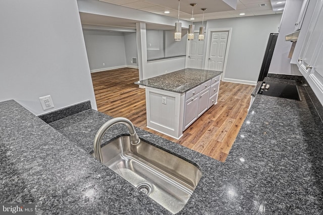 1637 Cold Bottom Rd, Sparks Glencoe, MD 21152 - kitchen with a sink, white cabinets, light wood-style floors, under cabinet range hood, and black electric cooktop