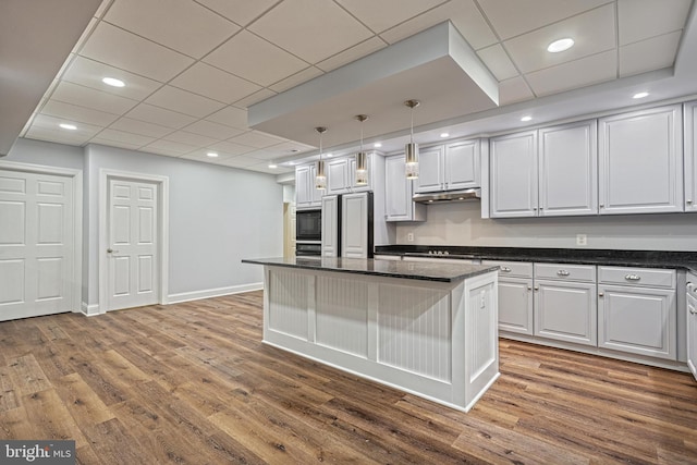 1637 Cold Bottom Rd, Sparks Glencoe, MD 21152 - kitchen with white cabinetry, a kitchen island, wood finished floors, black appliances, and recessed lighting