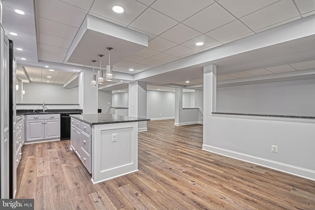 1637 Cold Bottom Rd, Sparks Glencoe, MD 21152 - kitchen with open floor plan, a kitchen island, light wood-type flooring, a sink, and black dishwasher