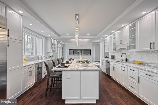 1637 Cold Bottom Rd, Sparks Glencoe, MD 21152 - kitchen with a sink, beverage cooler, a center island, white cabinets, and dishwasher